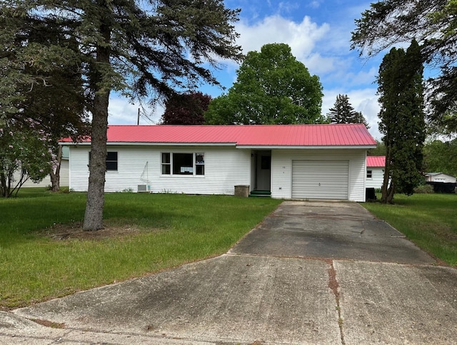175 S Hudnut, Barryton, MI 49305 - ranch-style home featuring an attached garage, driveway, a front lawn, and metal roof