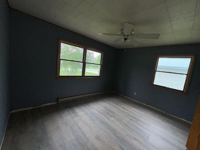 175 S Hudnut, Barryton, MI 49305 - empty room with a baseboard radiator, wood finished floors, ceiling fan, and baseboards