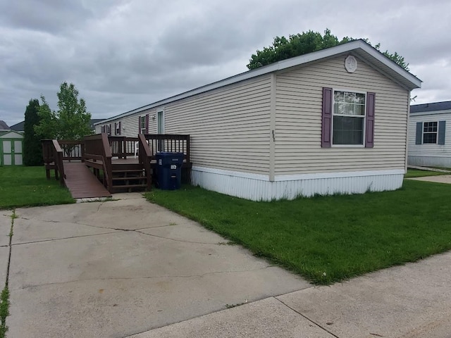5232 E Broadway, Mount Pleasant, MI 48858 - view of side of property with a wooden deck and a yard
