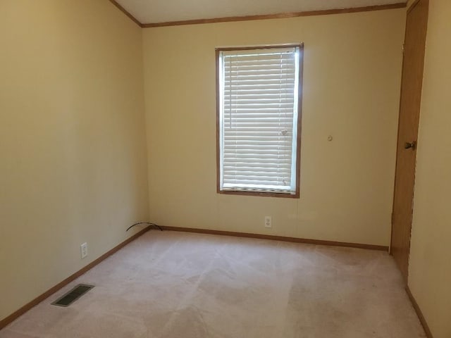 5232 E Broadway, Mount Pleasant, MI 48858 - spare room with light colored carpet, baseboards, and ornamental molding