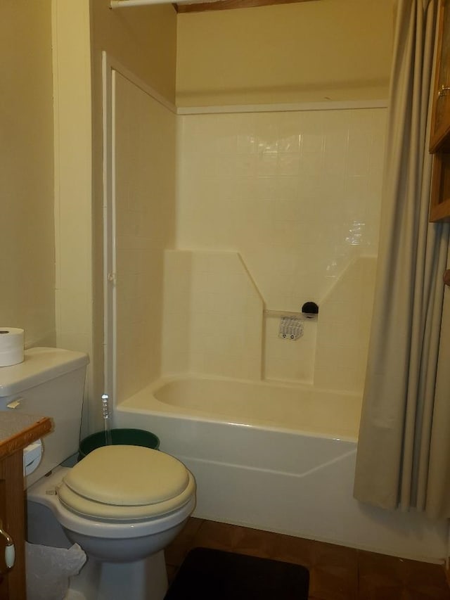 5232 E Broadway, Mount Pleasant, MI 48858 - bathroom featuring toilet, shower / bath combo with shower curtain, and tile patterned flooring