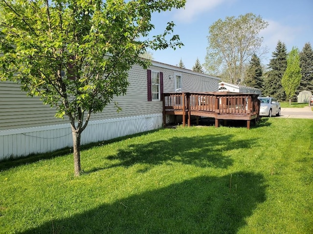 5232 E Broadway, Mount Pleasant, MI 48858 - view of grassy yard featuring a wooden deck