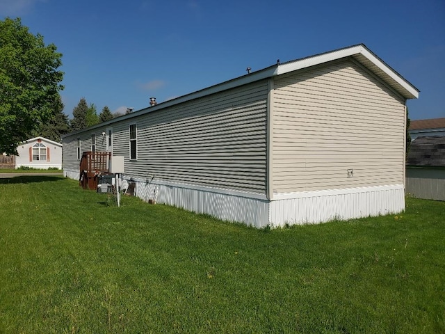 5232 E Broadway, Mount Pleasant, MI 48858 - view of side of home with a lawn
