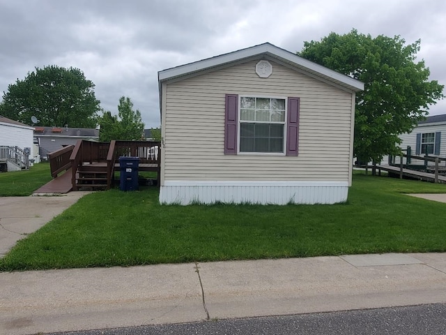 5232 E Broadway, Mount Pleasant, MI 48858 - view of side of home with a deck