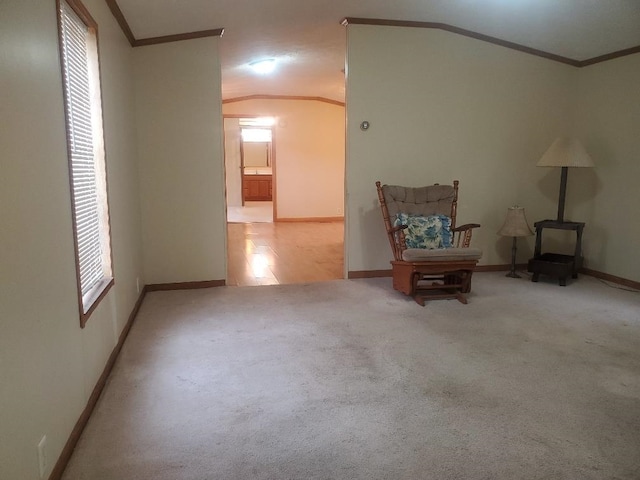 5232 E Broadway, Mount Pleasant, MI 48858 - living area featuring ornamental molding, a wood stove, baseboards, carpet flooring, and lofted ceiling