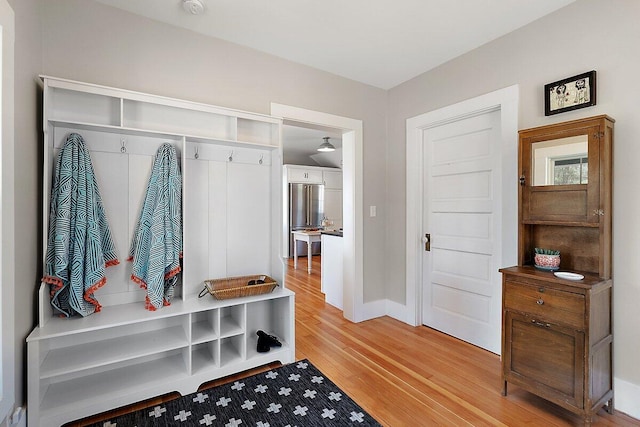 8282 W Harrison Rd, Mears, MI 49436 - mudroom with light wood-style flooring and baseboards