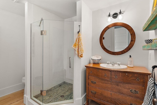 8282 W Harrison Rd, Mears, MI 49436 - full bath with a shower stall, wood finished floors, and vanity