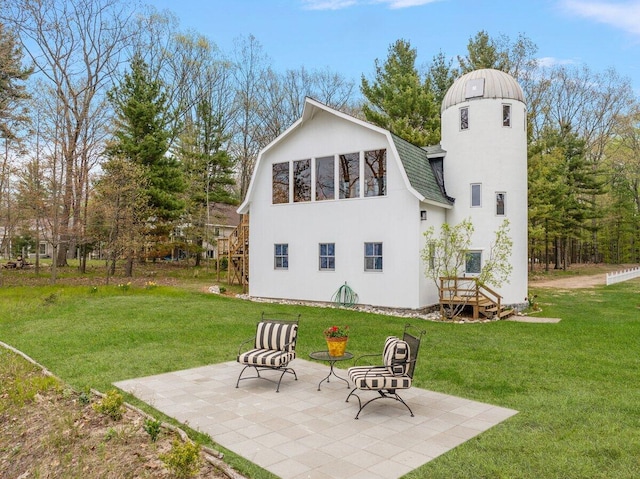 8282 W Harrison Rd, Mears, MI 49436 - rear view of house featuring a yard, a patio, and roof with shingles