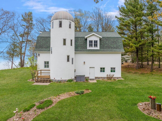 8282 W Harrison Rd, Mears, MI 49436 - rear view of property with a shingled roof, a lawn, and a chimney