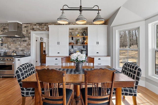 8282 W Harrison Rd, Mears, MI 49436 - dining space featuring light wood-style floors