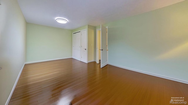 4200 Chapman Rd, Stockbridge, MI 49285 - spare room with baseboards and wood finished floors