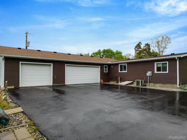 4200 Chapman Rd, Stockbridge, MI 49285 - view of front of house with central AC and asphalt driveway