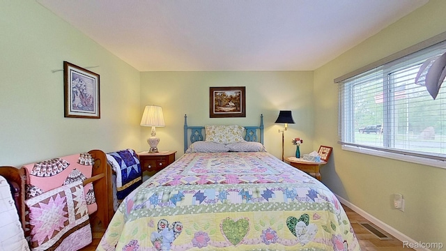 4200 Chapman Rd, Stockbridge, MI 49285 - bedroom featuring wood finished floors and baseboards