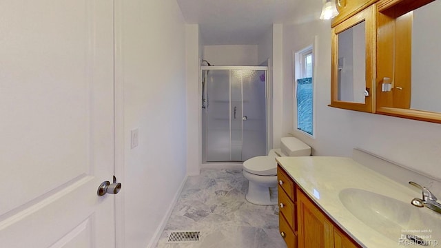 4200 Chapman Rd, Stockbridge, MI 49285 - full bathroom featuring a stall shower, vanity, toilet, baseboards, and marble look tiles