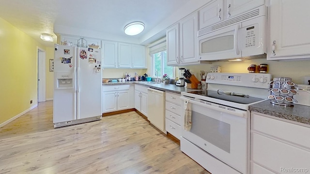 4200 Chapman Rd, Stockbridge, MI 49285 - kitchen with white appliances, white cabinets, and light wood-type flooring