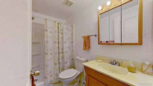 4200 Chapman Rd, Stockbridge, MI 49285 - bathroom featuring vanity, toilet, and shower / bath combo