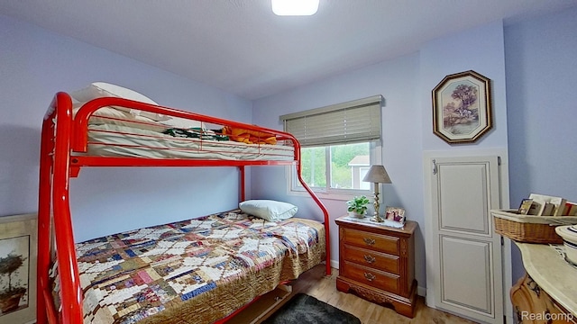 4200 Chapman Rd, Stockbridge, MI 49285 - bedroom with light wood finished floors