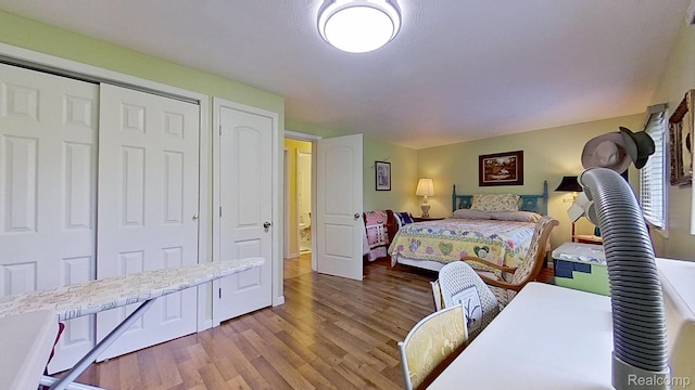 4200 Chapman Rd, Stockbridge, MI 49285 - bedroom featuring wood finished floors and a closet