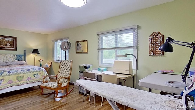 4200 Chapman Rd, Stockbridge, MI 49285 - bedroom with wood finished floors and a desk