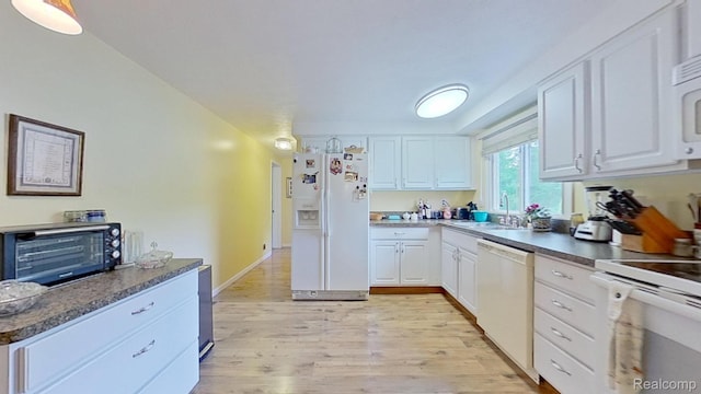 4200 Chapman Rd, Stockbridge, MI 49285 - kitchen with white appliances, a sink, light wood finished floors, and white cabinetry