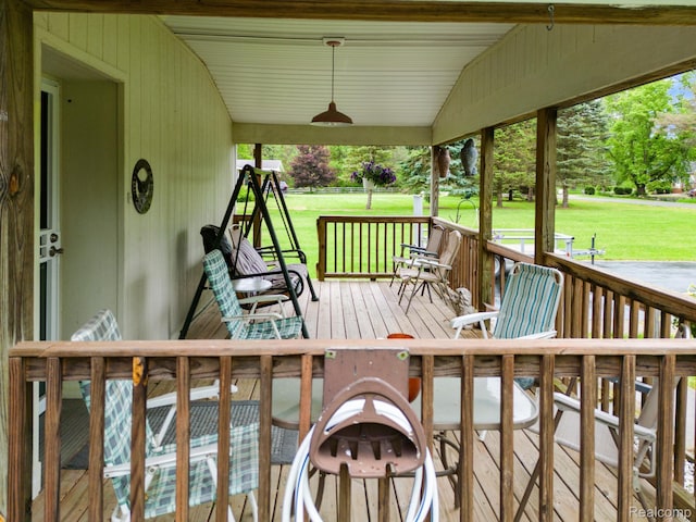 4200 Chapman Rd, Stockbridge, MI 49285 - wooden porch featuring a yard