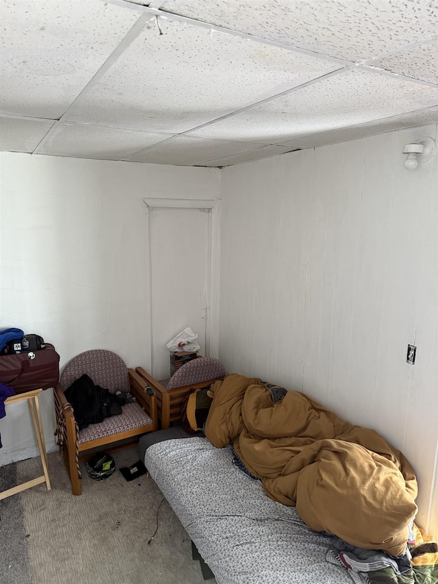 1541 Emily St, Saginaw, MI 48601 - living area with carpet floors and a paneled ceiling