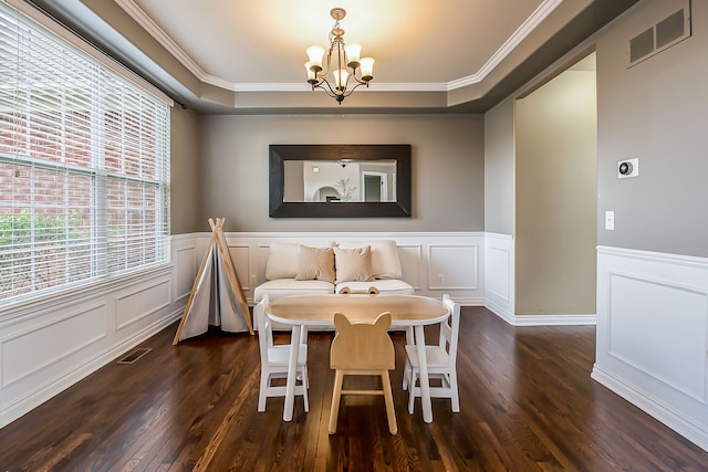 58799 Carriage Ln, South Lyon, MI 48178 - dining room with a chandelier, ornamental molding, a decorative wall, dark wood-style flooring, and a wainscoted wall