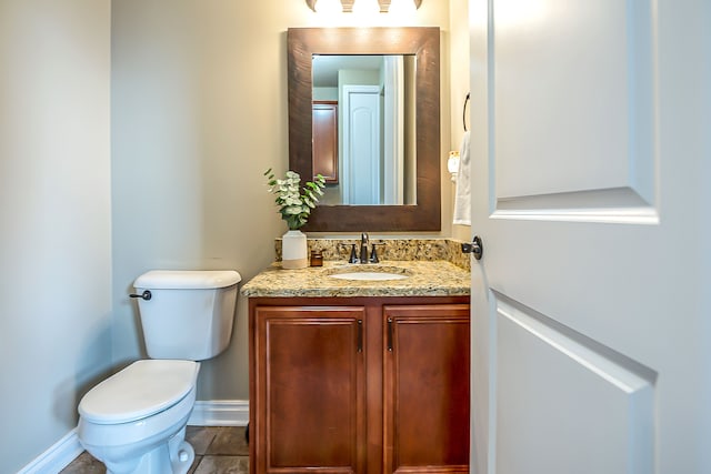 58799 Carriage Ln, South Lyon, MI 48178 - half bathroom with vanity, toilet, and baseboards