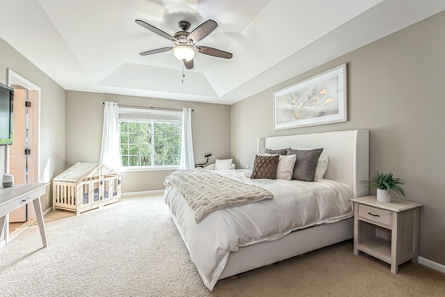 58799 Carriage Ln, South Lyon, MI 48178 - bedroom featuring a tray ceiling, light colored carpet, baseboards, and ceiling fan