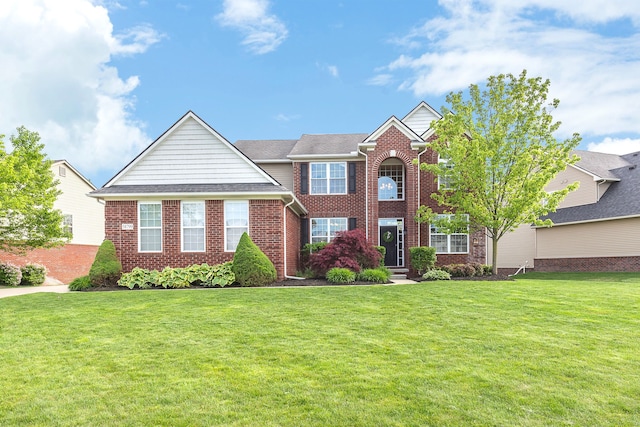 58799 Carriage Ln, South Lyon, MI 48178 - view of front of home with a front yard and brick siding