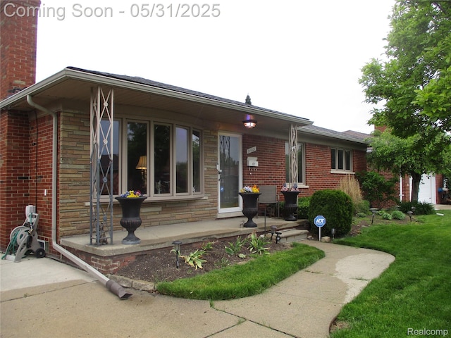 21001 Winkel St, Saint Clair Shores, MI 48081 - rear view of property with brick siding, a chimney, and stone siding