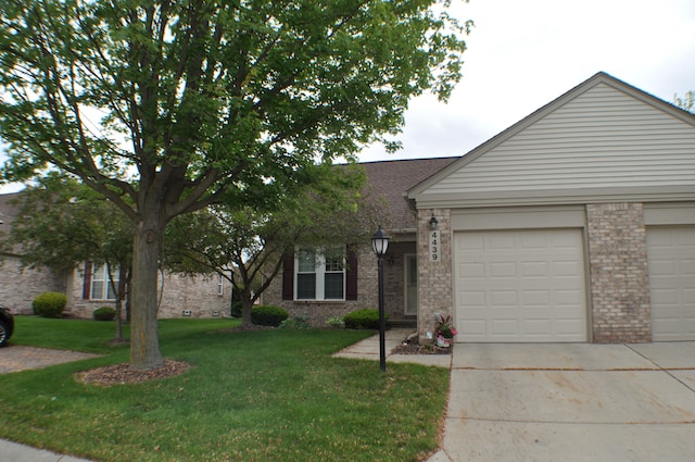 4439 Hunters Cir W, Canton, MI 48188 - view of front of house featuring brick siding, driveway, an attached garage, and a front lawn