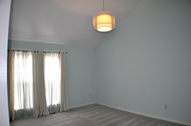 4439 Hunters Cir W, Canton, MI 48188 - spare room with lofted ceiling, carpet flooring, and baseboards