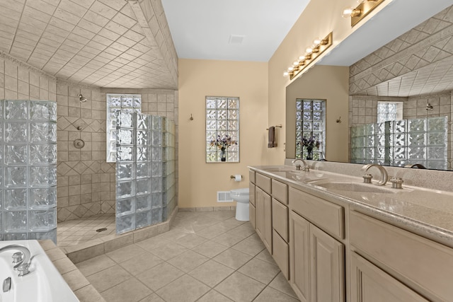 9997 Applegate Ln, Brighton, MI 48114 - bathroom featuring a walk in shower, tile patterned flooring, a bath, and double vanity