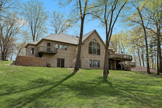 9997 Applegate Ln, Brighton, MI 48114 - rear view of property with stairs, a deck, brick siding, and a lawn