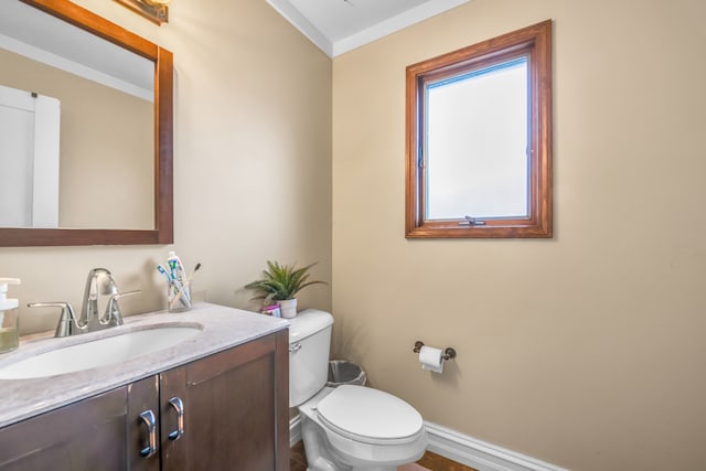 38342 Sleigh Dr, Sterling Heights, MI 48310 - half bathroom with toilet, vanity, baseboards, and ornamental molding