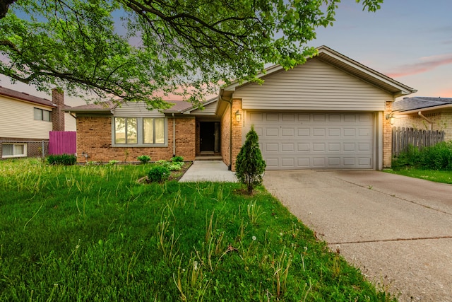 38342 Sleigh Dr, Sterling Heights, MI 48310 - view of front of home with brick siding, fence, a garage, and driveway