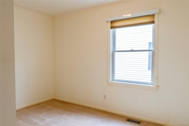 4359 Springbrook Dr, Swartz Creek, MI 48473 - empty room featuring carpet, crown molding, plenty of natural light, and baseboards