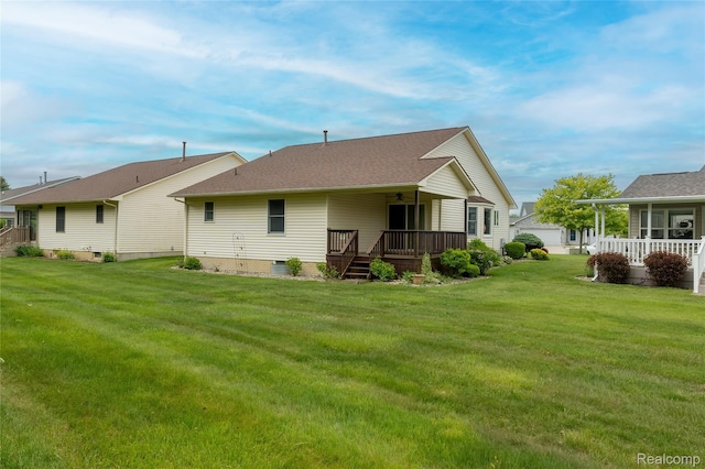 4359 Springbrook Dr, Swartz Creek, MI 48473 - back of house featuring a yard, covered porch, a shingled roof, crawl space, and an outdoor structure