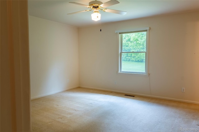 4359 Springbrook Dr, Swartz Creek, MI 48473 - unfurnished room with light carpet, a ceiling fan, and baseboards