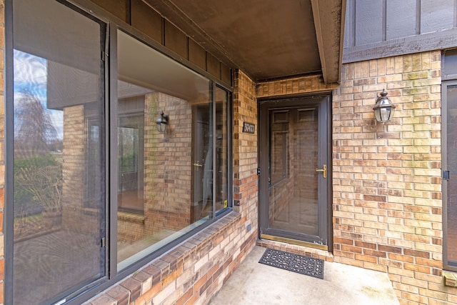 entrance to property with brick siding