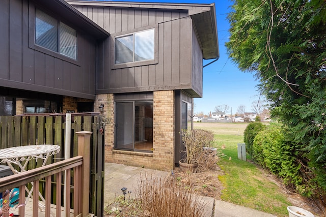 view of home's exterior with brick siding