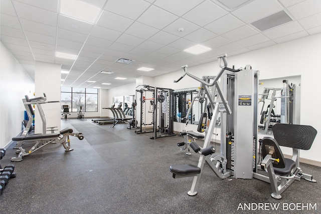 159 S River Ave Unit 503, Holland, MI 49423 - exercise room featuring a paneled ceiling and baseboards