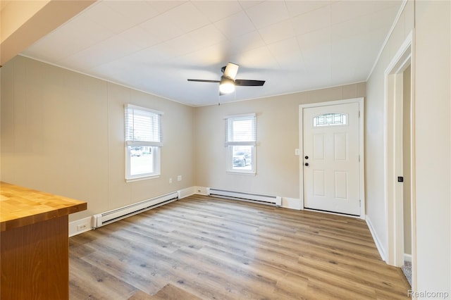 1953 Elmhurst St, Canton, MI 48187 - entryway with baseboard heating, a baseboard heating unit, light wood finished floors, ceiling fan, and ornamental molding