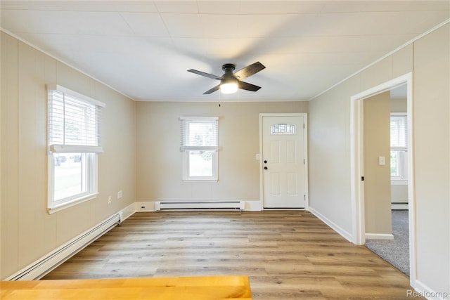 1953 Elmhurst St, Canton, MI 48187 - foyer with baseboard heating, ornamental molding, light wood-style floors, a ceiling fan, and baseboards