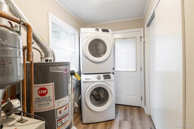 1953 Elmhurst St, Canton, MI 48187 - washroom with stacked washer and clothes dryer, water heater, crown molding, and light wood-style flooring