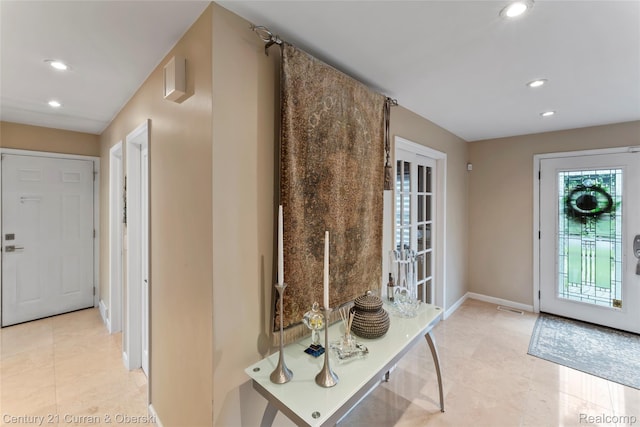 26155 Timber Trl, Dearborn Heights, MI 48127 - foyer with recessed lighting, light tile patterned floors, and baseboards