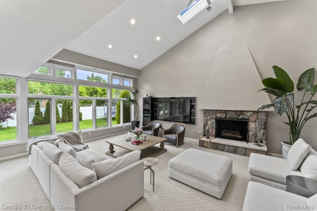 26155 Timber Trl, Dearborn Heights, MI 48127 - carpeted living room with high vaulted ceiling, a fireplace, recessed lighting, baseboards, and a skylight
