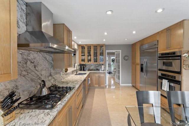 26155 Timber Trl, Dearborn Heights, MI 48127 - kitchen with wall chimney exhaust hood, appliances with stainless steel finishes, tasteful backsplash, recessed lighting, and glass insert cabinets