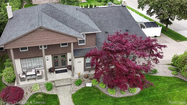 26155 Timber Trl, Dearborn Heights, MI 48127 - view of front of property with french doors, a shingled roof, brick siding, and a front yard